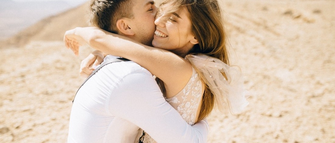 Loving couple hugging on beach