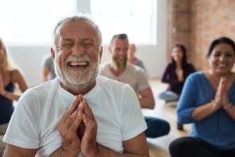 Happy people doing yoga- building a strong health foundation