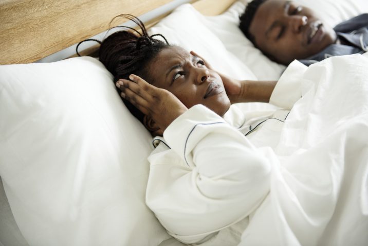 Woman suffering from her partner's Sleep Apnea