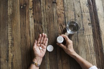 A woman taking a prescription painkiller