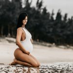 Pregnant woman getting ready to swim