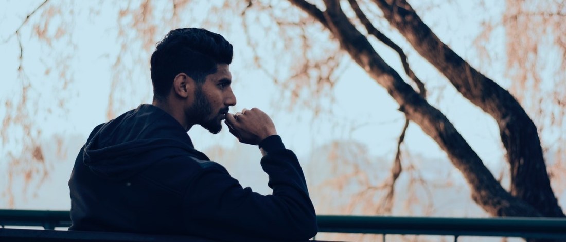 Man on bench thinking about life