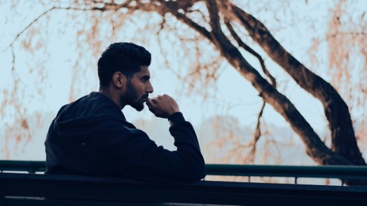 Man on bench thinking about life