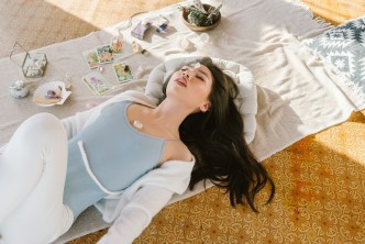 Woman laying on floor developing her spiritual self