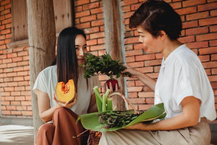 Woman eating fruits and herbs for improved health